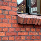 Śmietankowe wnętrze z cegłą w tle Dom Tychy